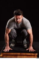 Larry Steel  1 boots dressed grey camo trousers grey t shirt kneeling shoes whole body 0001.jpg